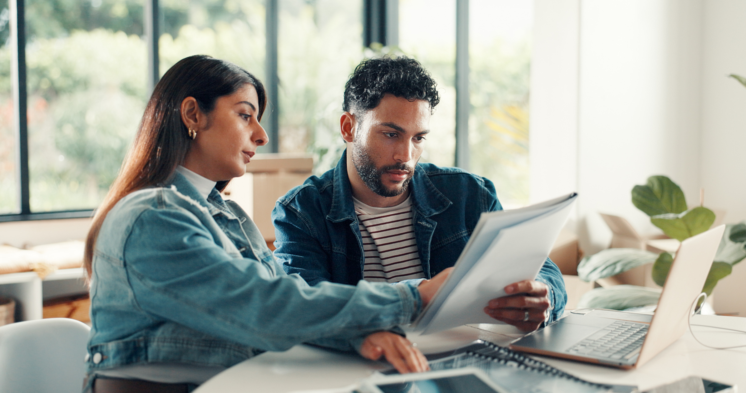 House, documents and couple with laptop, discussion and planning finance with savings. Assets, paperwork and man with woman, pc and expenses with budget, mortgage payment or bills with life insurance